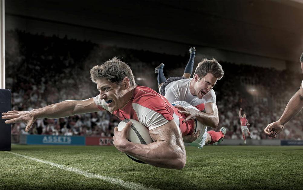 A rugby player diving to score a try - rugby is one of the sports you can include in your parlay bet.